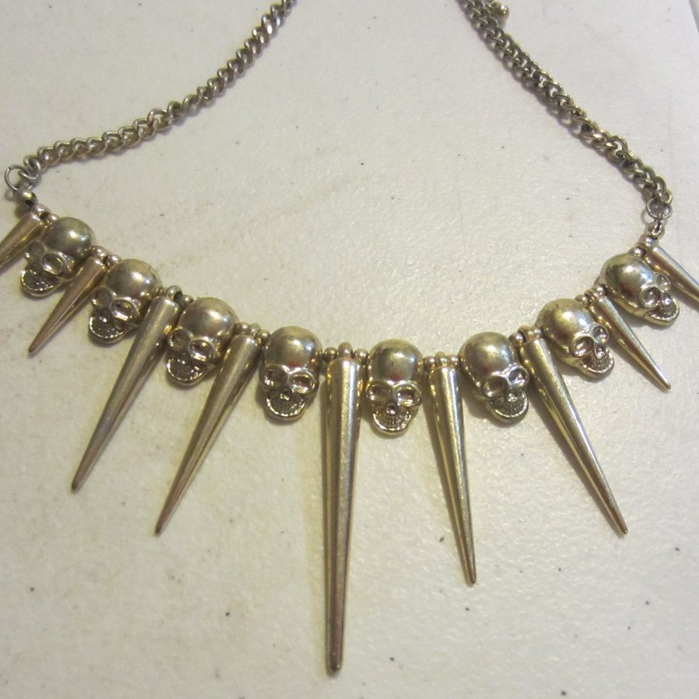 Gold tone skull necklace